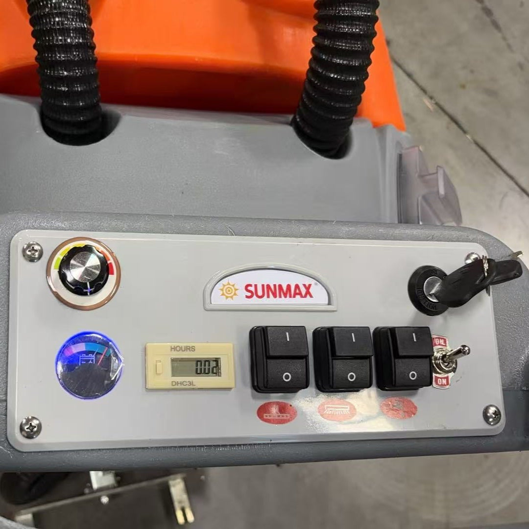 Control panel of a Sunmax machine on a concrete floor
